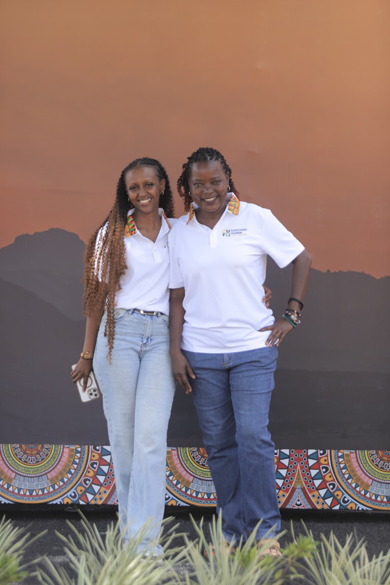 Two members of the festival team smiling together