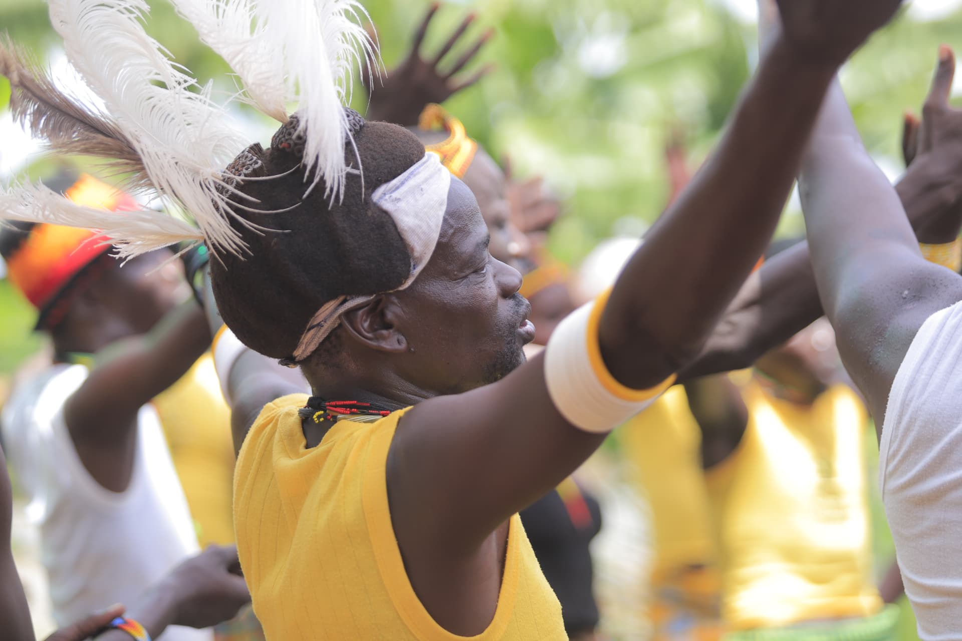 A dancer raises his hands during the performance